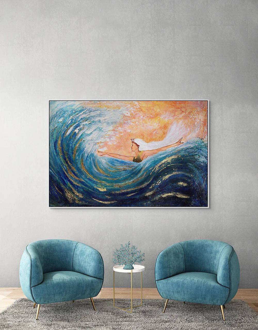 Hue the Artist's large blue and orange print of a woman surfing a big wave, with arms wide, hanging above two modern teal armchairs.