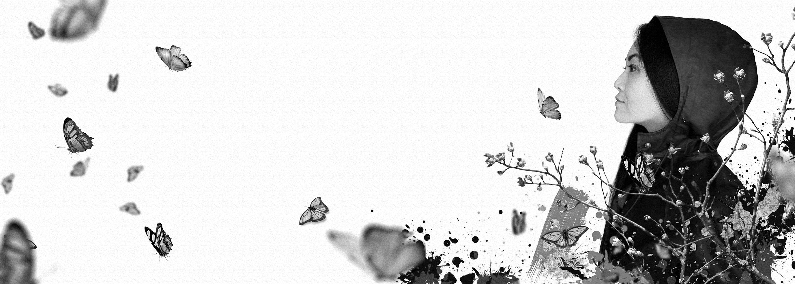 Black and white profile of a woman gazing at butterflies, with twig-like branches and white buds in front of her.