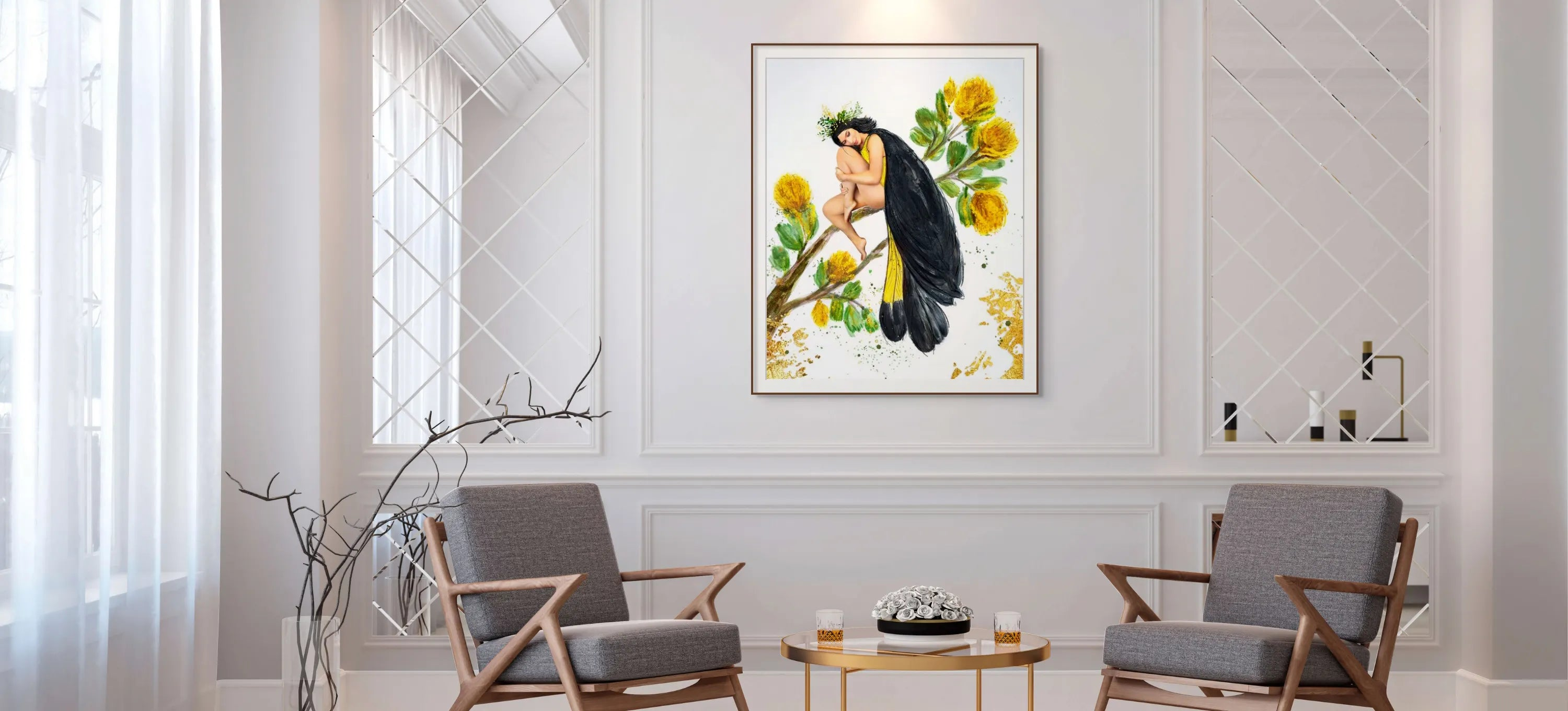 A large framed print of a birdlike woman on a branch hangs in a sunlit room with two grey chairs.